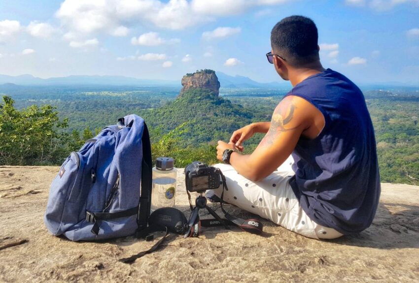 a man on a cliff mountain