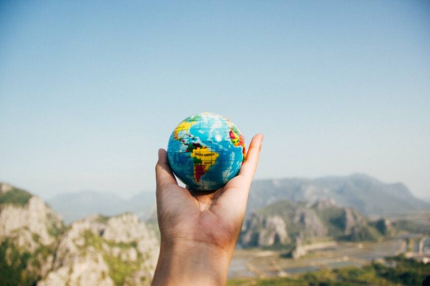 a person holding a globe